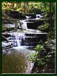 Several cascading waterfalls in Buttermilk Falls State park, Ithaca, NY.
