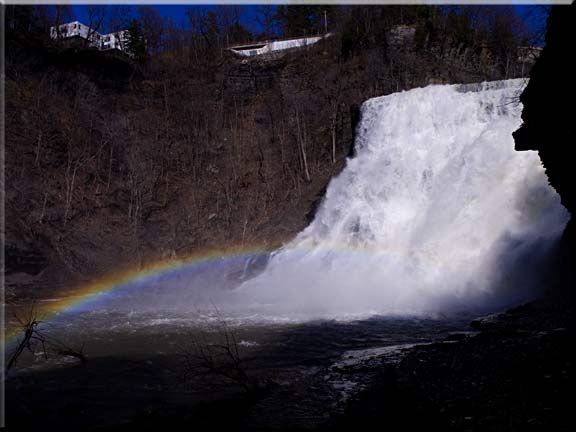 One of several waterfall photographs of Ithaca falls with a rainbow.
