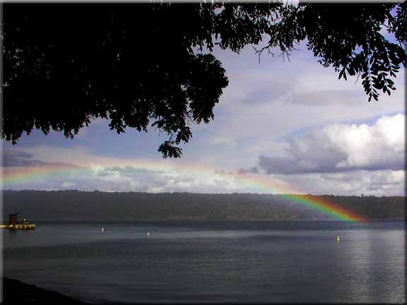 A rainbow hovers over Cayuga Lake as seen from Taughannock Falls State Park.
