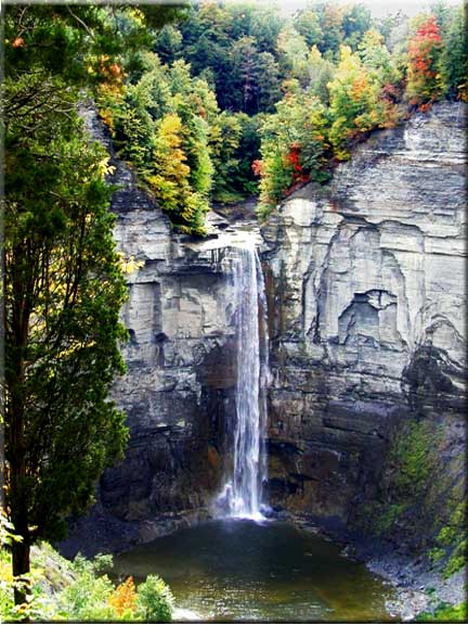 Bright sparks of color show from the top of Taughannock Falls.