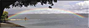 A perfect rainbow arching over Cayuga Lake