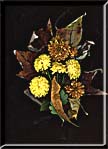 A formal bouquet of dried leaves and chrysanthemums.