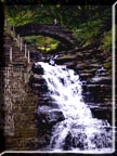 Photo of the waterfall below the stone bridge in Cascadilla Gorge.