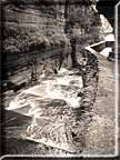 The upper gorge at Robert Treman State Park in a sepia photograph.